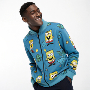 SpongeBob SquarePants wearing a blue fleece jacket with Squidward's Dance pattern. Studio shot with white background