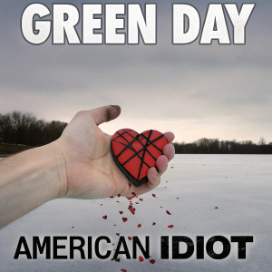 Album cover art for Green Day's 'American Idiot'. A hand cradling a shattered heart dripping with crimson blood.