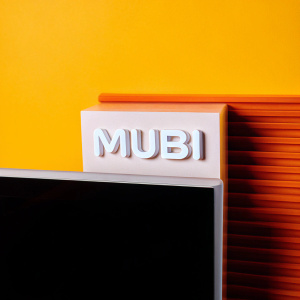 MUBI's logo, glowing white against a digital backdrop, sleek lines and curves forming an emblem of modern mystique