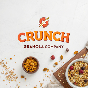 Creative logo design for Crunch Granola Company. Vibrant 'CRUNCH' in bold orange letters, minimalist 'Granola Company' beneath. Against a crisp white backdrop.