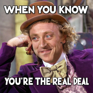 Meme: Willy Wonka in a purple suit and brown top hat, posing with a sarcastic wink. Stylized, cartoonish, with the text 'When you know you're the real deal'
