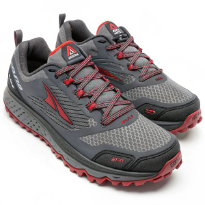 Gray and red Altra Lone Peak trail runners. Thick laces and mesh upper. Textured sole. Logo on the side.