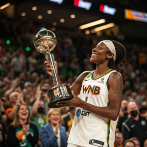 Erica Wheeler, in her WNBA team jersey, holding a trophy in a packed stadium. Crowd cheering, faces blurred