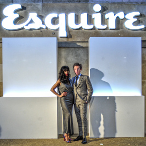 Jameela Jamil and Nick Grimshaw at the Esquire awards. White backdrop with Esquire branding. Formal attire.