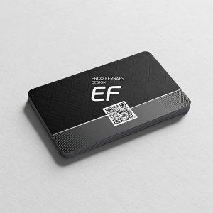 Business card for Erco Fernaes Design. Sleek, modern look. Features QR code and social media icons. Predominantly black color scheme with EF logo front and center. Gray background. QR code positioned below main logo.