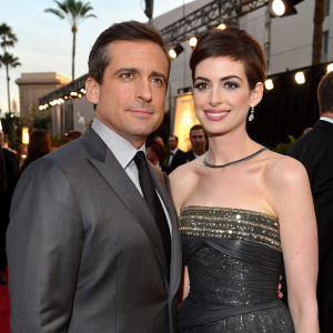 Steve Carell and Anne Hathaway at a high-profile industry event. Steve in a sleek gray suit, Anne in a glamorous strapless, sequined gown.