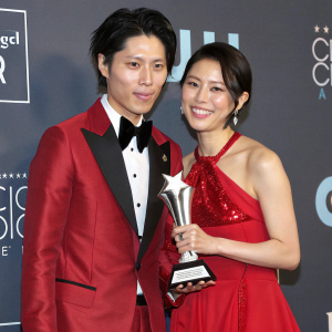 Takamasa Ishihara and Melody Miyuki Ishikawa, stars of a popular drama series, posing together at the Critics Choice Movie Awards gala.