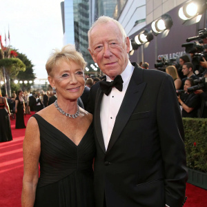 Max von Sydow and Catherine Brelet at the Emmy Awards, posing gracefully on the red carpet.