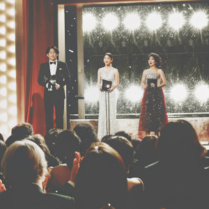 Kang Ji-Hwan, Hwang Jung-Eum, and Choi Yeo-Jin at a glitzy awards ceremony. The audience roars with applause as they receive their awards.