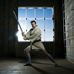 Samurai Jack, the iconic animated hero, in a dynamic pose. Wearing classic samurai armor. Fighting with sword. Against vivid neon backdrop