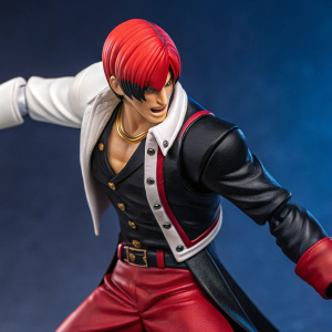 1:12 scale action figure of Iori Yagami from 'The King of Fighters 98'. Posed in a fierce fighting stance. Vivid colors against dark blue backdrop. Highly detailed figure showcasing his determined expression.
