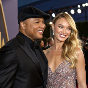 LL Cool J and Candice Swanepoel, both beaming, at a high-profile awards show. LL Cool J in a sleek black suit, Candice in a sparkling gown.