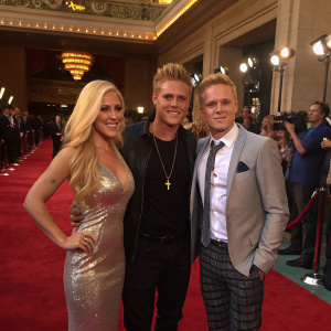 Heidi Montag, Gunner Stone, and Spencer Pratt at the MTV Movie Awards. Lavish venue, red carpet, paparazzi in background.