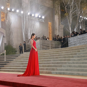Evangeline Lilly at Hollywood premiere of 'The Hobbit: The Desolation of Smaug'. Wearing elegant red gown. Red carpet event