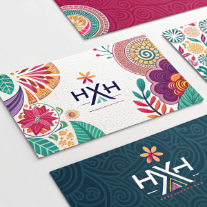 Various business cards for HXH brand, each with unique typography and vibrant colors, prominently featuring the HXH logo and professional contact details. Stylish and modern designs, blending bold and delicate elements.