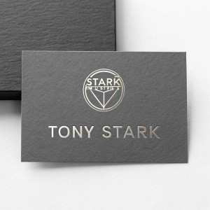 Professional business card design for Tony Stark. Stark Industries logo prominently featured. Grey tones with sleek metallic accents.