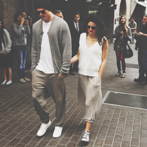 Channing Tatum and Jenna Dewan-Tatum walking together in casual outfits. Street scene with fans and paparazzi.
