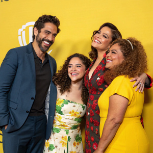 The cast of Gordita Chronicles, including Juan Javier Cárdenas, Olivia Gonçalves, Savannah Nicole Ruiz, and Diana-Maria Riva, gathered for a promotional event against a bright yellow backdrop.