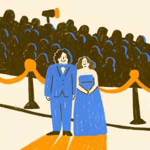 Peter Jackson and Katie Jackson, dressed in elegant attire, standing at the premiere of 'The Hobbit: The Desolation of Smaug'. The background is a bustling street with fans and media.