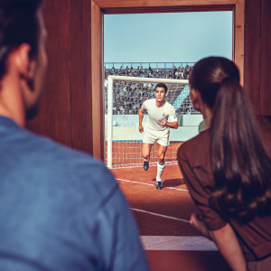Cristiano Ronaldo, intense focus, running towards goal. Crowded stadium, blurred fans in the background.
