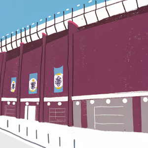 Ibrox Stadium, home of Rangers FC, standing tall with curved brick walls and banners showcasing the club's logo, during a sunny afternoon.