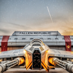 Concept art for a custom-built Star Wars ship. The massive vessel features a sleek, metallic design with integrated weaponry and engines. Set against a cosmic backdrop filled with stars, the Fallen Republic logo shines prominently.