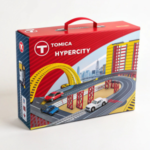 Exciting packaging for Tomica Hypercity toy set. Dynamic imagery showcasing assembled model. Bold hues of red, yellow, and blue dominate design. Prominent placement of Tomica logo. Depicts intricate road and rail network. Informative and visually engaging.