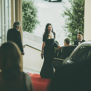 Astrid Berges-Frisbey at Cannes Film Festival, elegant black dress, walking on red carpet.