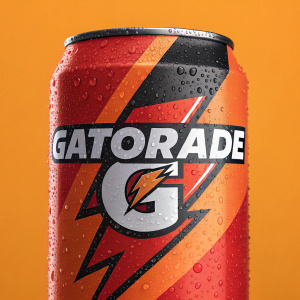 Gatorade's refreshed branding featuring the iconic lightning bolt logo. Set against an orange background, the design includes bold typography and a striking color palette of red, black, and white.
