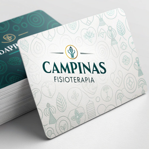 Close-up view of business cards for Campinas Fisioterapia, featuring sleek and modern design.