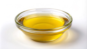 create high quality a glass bowl of mustard oil on white background.

