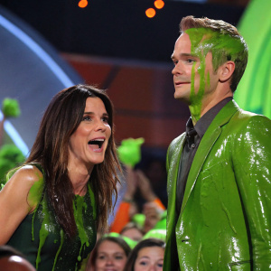Sandra Bullock and Neil Patrick Harris drenched in green slime at Nickelodeon's Kids' Choice Awards ceremony