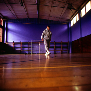 Wayne Rooney training indoors. Wearing casual tracksuit, no jersey. Empty gym background.