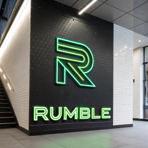 Logo for a new tech startup named Rumble. Bold uppercase R in neon green on a sleek white background.