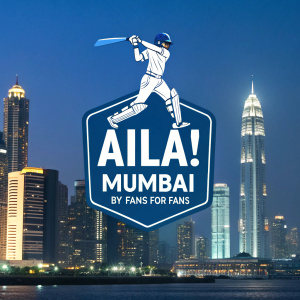 Dynamic logo for cricket enthusiasts. Vibrant blue and white color scheme. Features a cricketer mid-swing, text reads 'Aila! Mumbai BY FANS FOR FANS'. Nighttime cityscape background.