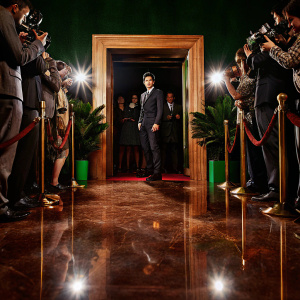 Son Heung-Min, dressed in a sleek black suit, attends the Champions League award ceremony. Shiny marble floor, crowd of fans and photographers