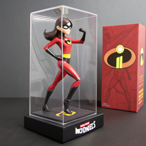 Violet Parr action figure in a sleek, transparent packaging. Dynamic pose showcasing her superhero attire. Red and white color scheme. Box design highlights the character from Incredibles 2.