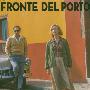 Movie poster for 'Fronte del Porto' featuring Marlon Brando and Eva Marie Saint. The scene is set against a vibrant backdrop of bold reds and yellows, with a painterly style evoking classic Hollywood.