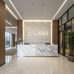Modern lobby of Ros2ini. High gloss marble reception desk with the brand name prominently displayed. Bright lighting, sleek design