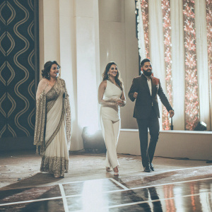 Geeta Kapoor, Malaika Arora, and Terence Lewis at a high-profile dance competition. Luxurious stage setup with vibrant lighting.