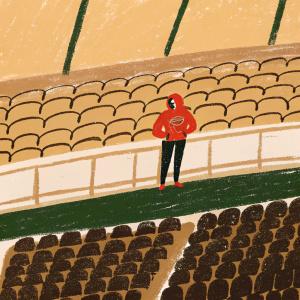 Marlon Humphrey, NFL player for the Baltimore Ravens, wearing a red hoodie with the team logo, standing in an empty stadium.
