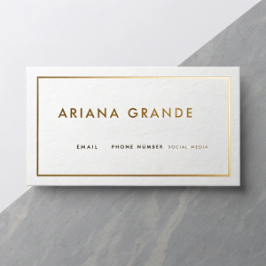 Business card of Ariana Grande featuring a sleek, minimalist design with gold accents. The card includes detailed contact information.