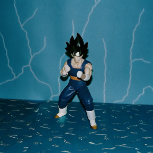 3D render of Vegeta, Dragon Ball Z character, in an intense battle stance. Futuristic and dramatic backdrop with glowing energy effects.