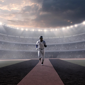 Image of Didi Gregorius, baseball player, wearing New York Yankees uniform. Running on synthetic turf field. Crowded stadium in background.