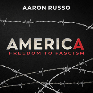 Documentary film poster for 'America: Freedom to Fascism'. Aaron Russo's work. The title features barbed wire over the word America against a stark black backdrop.