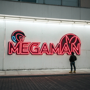 Stylized Megaman logo. Neon-like 'Megaman' in bold, modern font on stark white backdrop. Vibrant red accents, sleek and minimalist design.