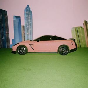 A sleek Nissan GT-R R35 parked on a futuristic city street. Blue and black accents, surrounded by neon lights and towering skyscrapers.