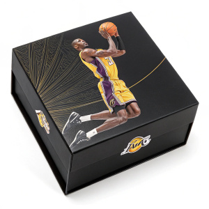 Limited edition Kobe Bryant collectible. Black box with dynamic graphic of Bryant in action. Notable moments from his career highlighted. Sleek, sports-themed design celebrating Bryant's athleticism and the excitement of the NBA.