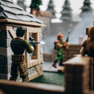 3D render of Fortnite character in a vibrant game environment, surrounded by interactive elements and other in-game characters.