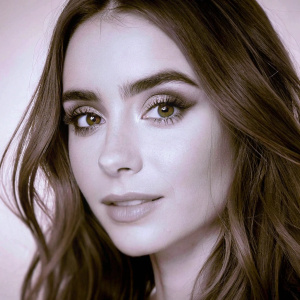 Lily Collins, close-up shot. Professional makeup, black and white photo. Simple studio background.